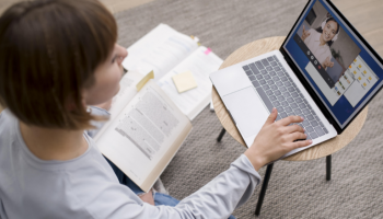 Female college counselor using college planner pro on her laptop to communicate with her students and prepare them for tests.