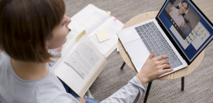 Female college counselor using college planner pro on her laptop to communicate with her students and prepare them for tests.