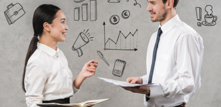 The difference Between Product Management And Portfolio Management is shown as two managers talk to each other in an office