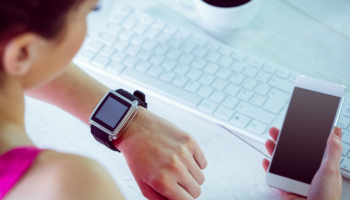 Betst time tracking apps for small business on a wristwatch that girl sees