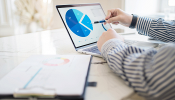 best budget dashboards shown on a laptop as a project manager uses it in his office