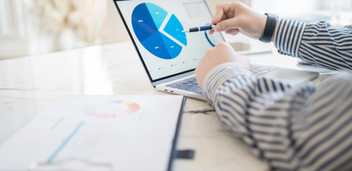 best budget dashboards shown on a laptop as a project manager uses it in his office