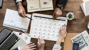 project planning adds value to your business a photo of project managers sitting around the table in the office planning a project