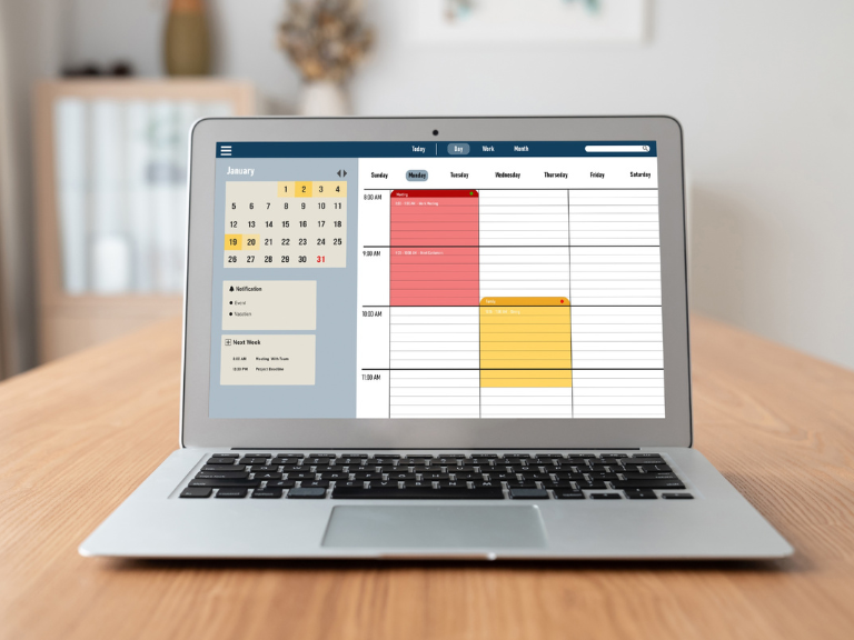 best planners for adhd shown on alaptop in an office. Screen shows a planner which is very simple and practical, similar to easynote