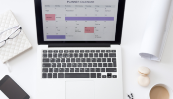 Hourly planner shown on a laptop screen on a table in a white office which can help you with daily plans