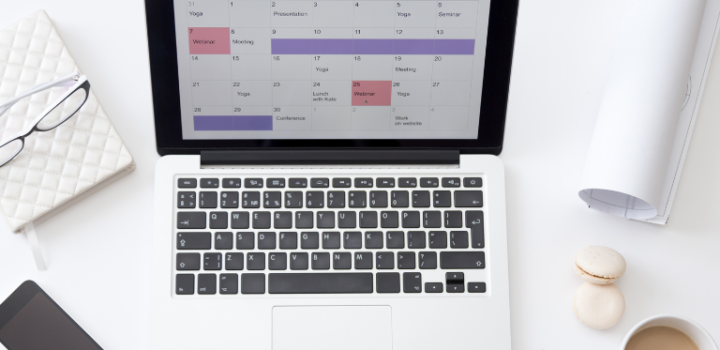Hourly planner shown on a laptop screen on a table in a white office which can help you with daily plans