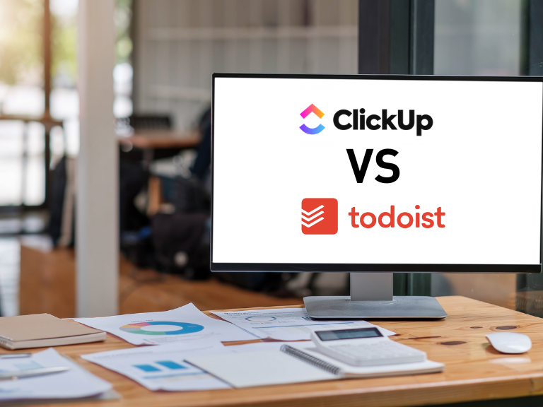 clickup vs todoist comparison shown on a blank monitor in an office shown for audiences compared to easynote
