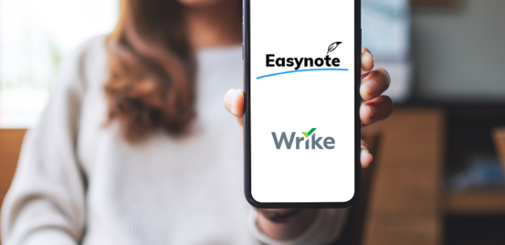 young businesswoman holding a easynote vs wrie written on her phone showing the comparison between the two tools